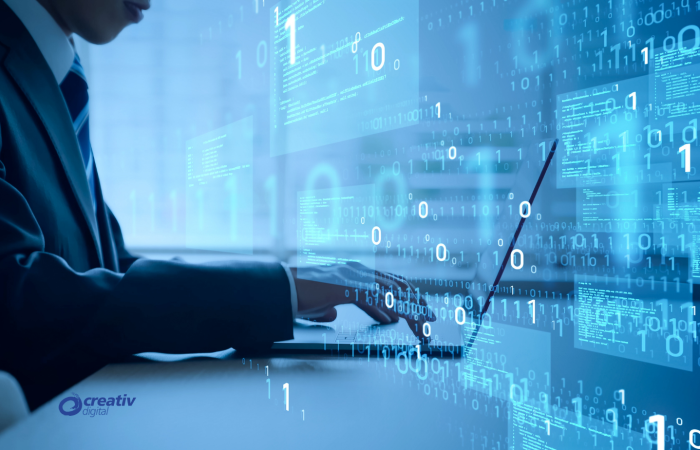 Business professional coding on a laptop with binary code and data overlays, representing AI.